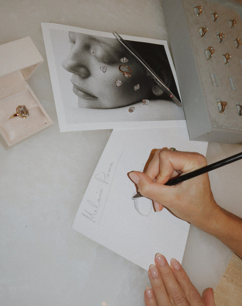 LINDELLI consultant drawing a custom engagement ring design as part of a bespoke custom consultation. 